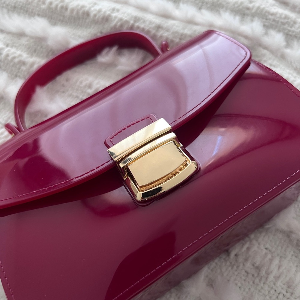Chic Red Handbag with Gold Chain